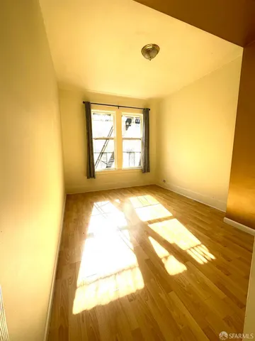 a bathroom with a granite countertop toilet sink and mirror
