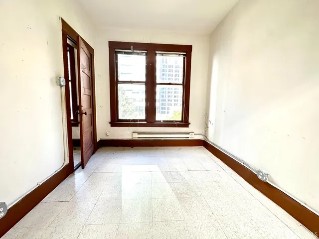 a view of an empty room and window