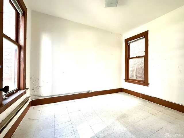 a view of an empty room with a window