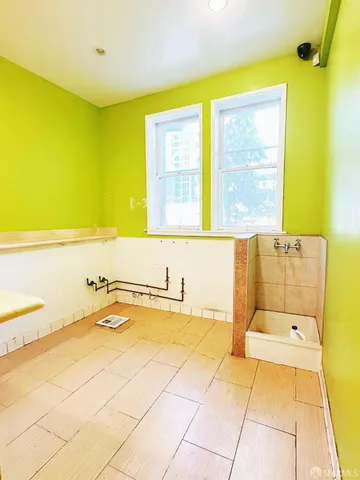 a bathroom with a bathtub and a sink