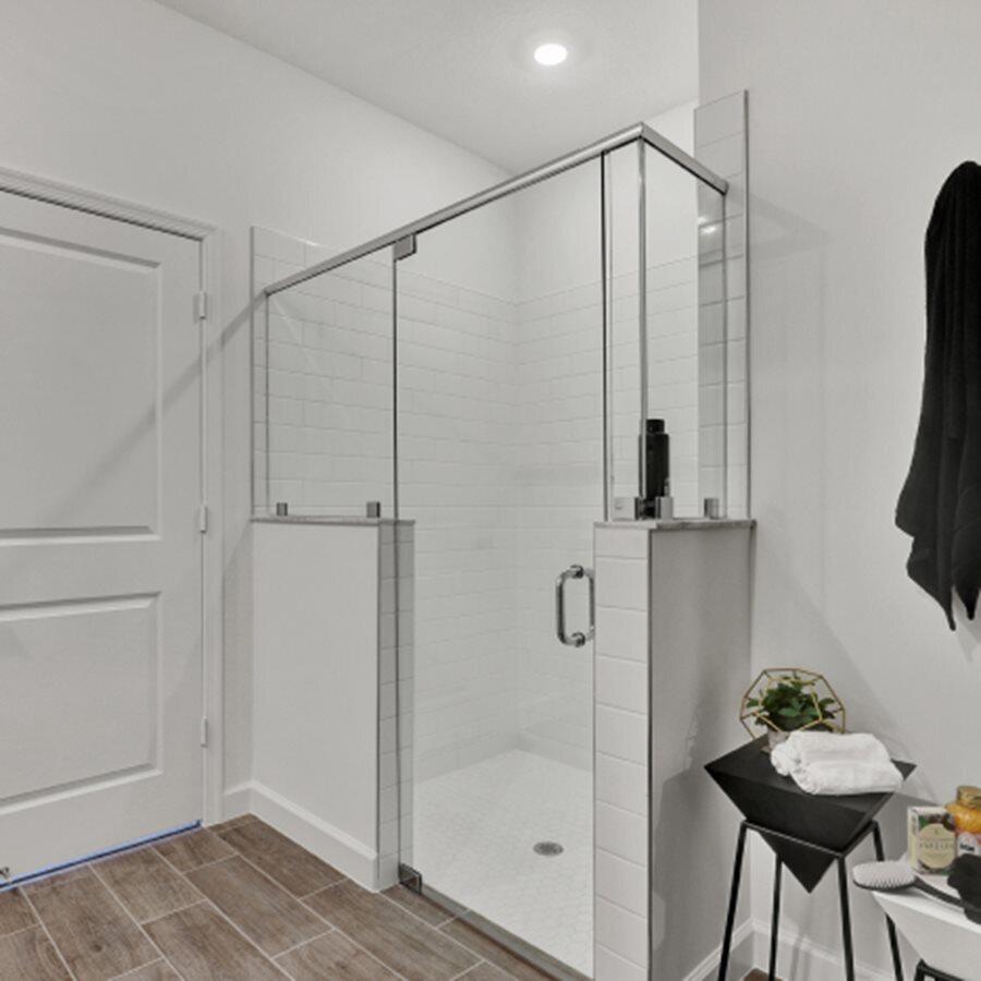 19781 Whispering Creek Road Loxahatchee, FL 33470 - Photo 11 of 22 a bathroom with a shower and a mirror