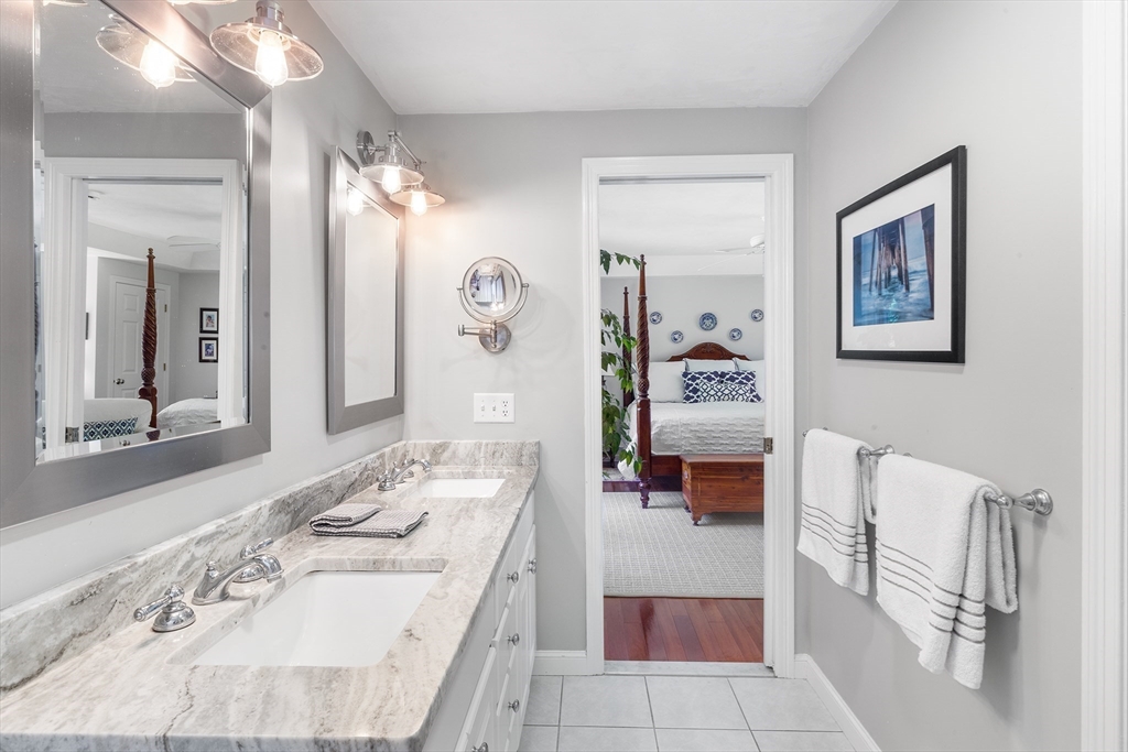 28 Broken Tree Road Medway, MA 02053 - Photo 24 of 42 a en suite bathroom with a double vanity sink and a mirror