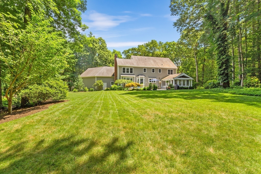 28 Broken Tree Road Medway, MA 02053 - Photo 42 of 42 a view of a house with a big yard and large trees