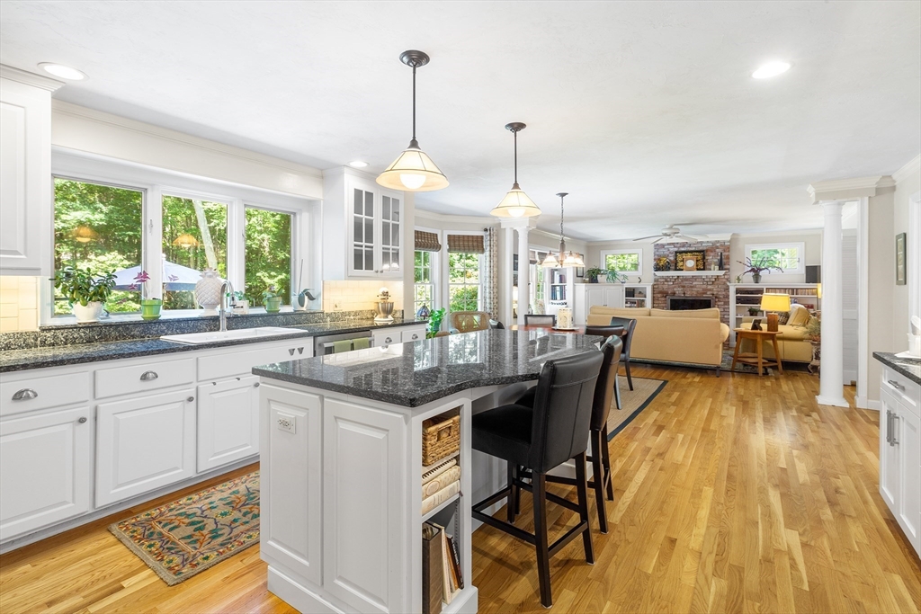 28 Broken Tree Road Medway, MA 02053 - Photo 6 of 42 a kitchen with stainless steel appliances granite countertop wooden floors and white cabinets