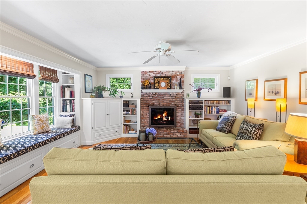 28 Broken Tree Road Medway, MA 02053 - Photo 10 of 42 a living room with furniture large window and a fireplace