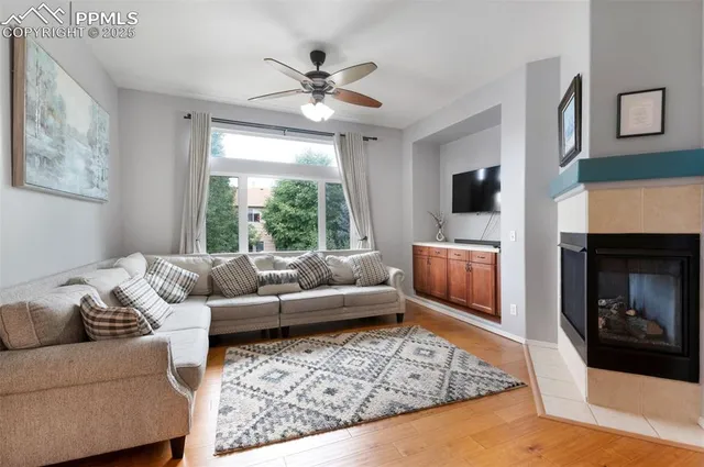 a living room with furniture and a fireplace