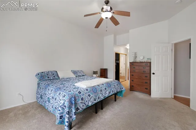 a bedroom with bed and closet