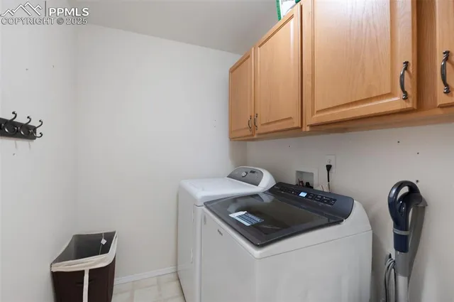 a kitchen with a sink a stove and cabinets