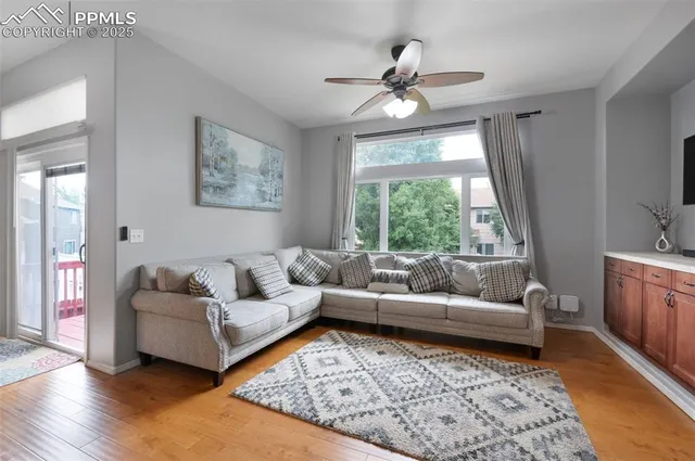 a living room with furniture and a large window