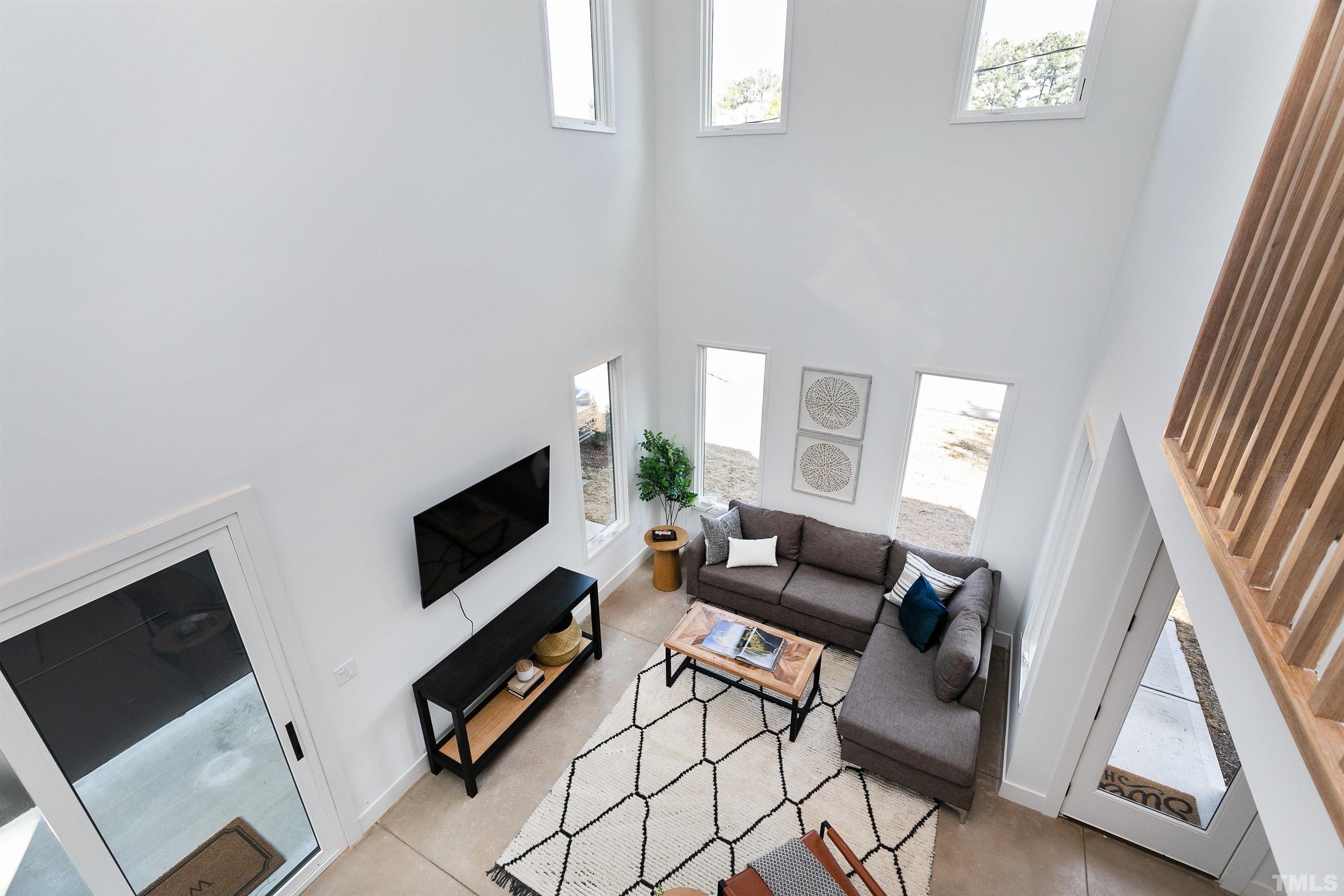 2159 Mayview Drive, Unit B Raleigh, NC 27607 - Photo 16 of 29 a living room with furniture and a flat screen tv