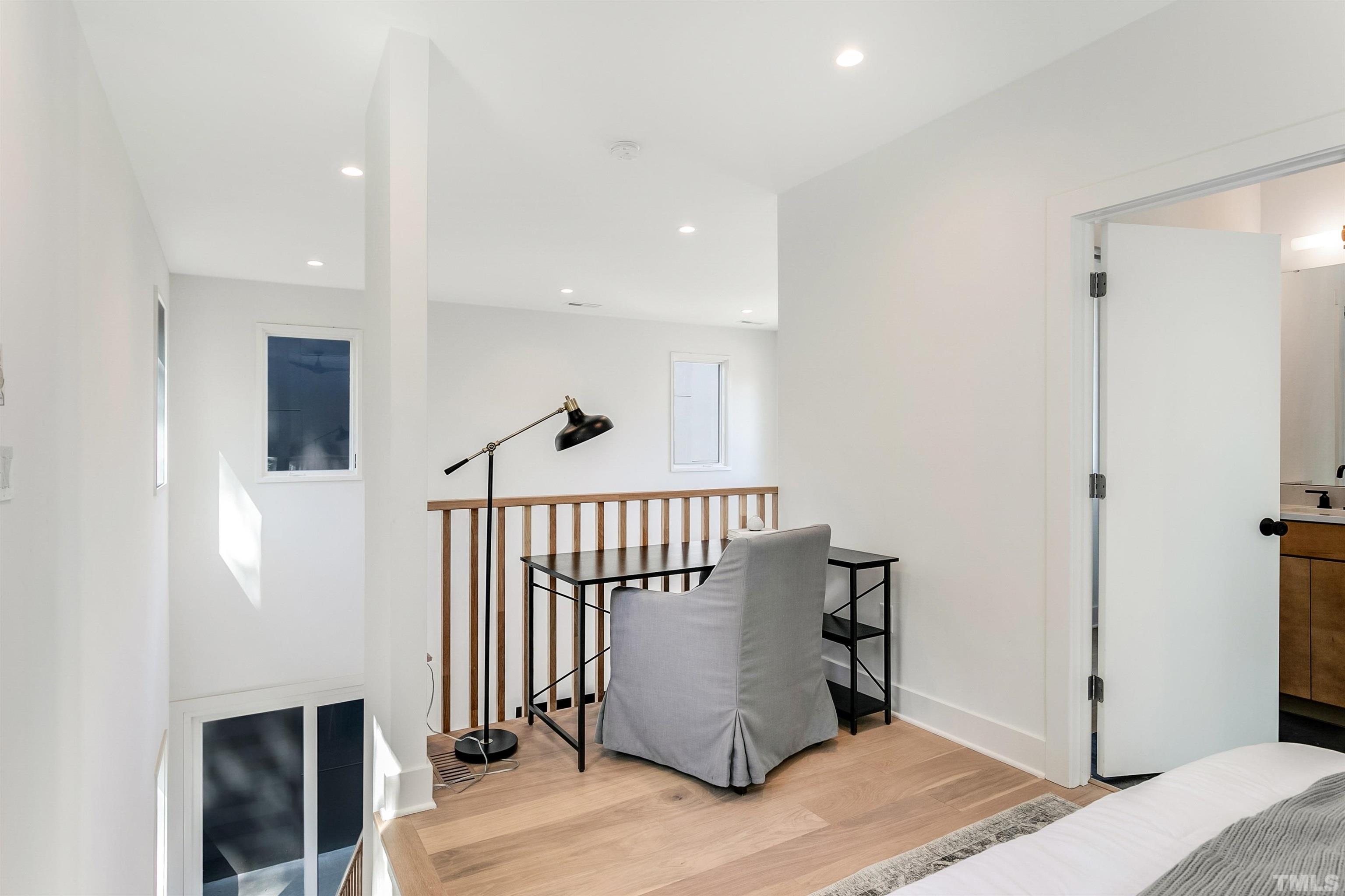 2159 Mayview Drive, Unit B Raleigh, NC 27607 - Photo 18 of 29 a view of entryway livingroom and hall with wooden floor