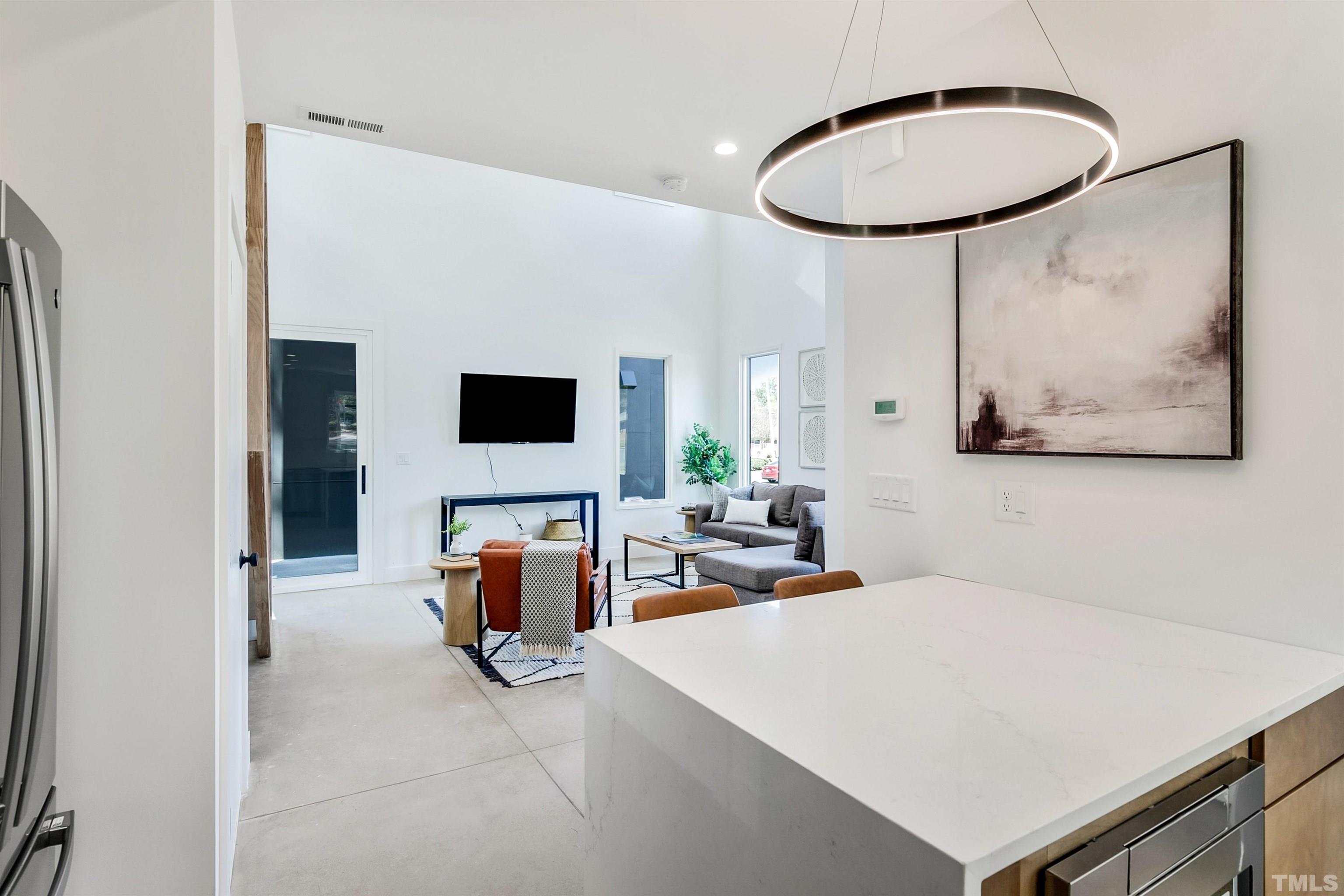 2159 Mayview Drive, Unit B Raleigh, NC 27607 - Photo 6 of 29 a living room with furniture and a flat screen tv