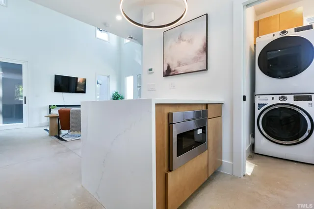 a view of livingroom with washer and dryer