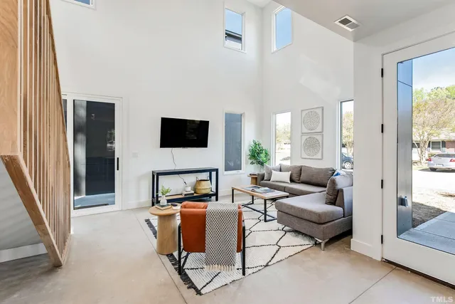 a living room with furniture and a flat screen tv