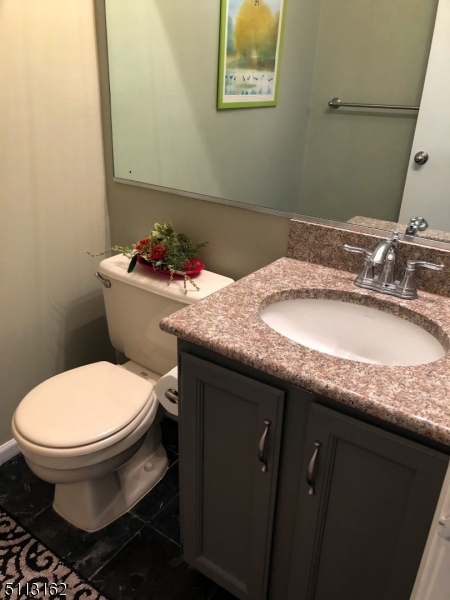 25 Stevens Court Bedminster, NJ 07921 - Photo 21 of 30 a bathroom with a granite countertop toilet sink and mirror