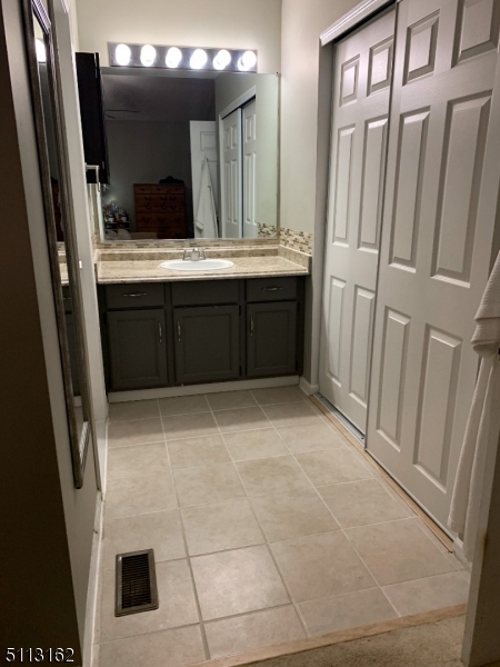 25 Stevens Court Bedminster, NJ 07921 - Photo 25 of 30 a bathroom with a sink and a mirror