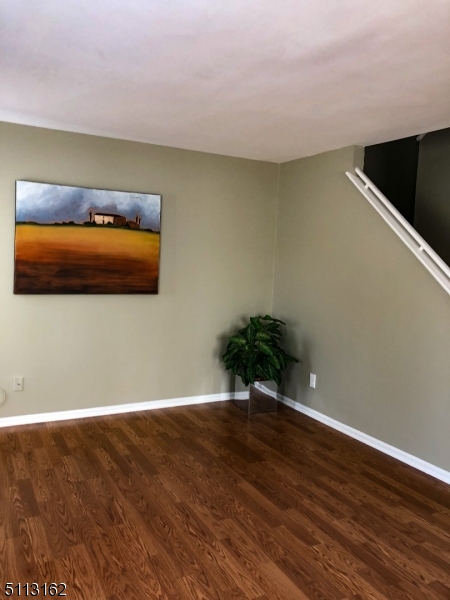 25 Stevens Court Bedminster, NJ 07921 - Photo 5 of 30 a view of an empty room with wooden floor and closet