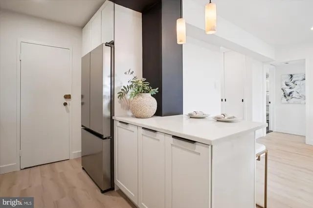 a view of bathroom with a sink and mirror
