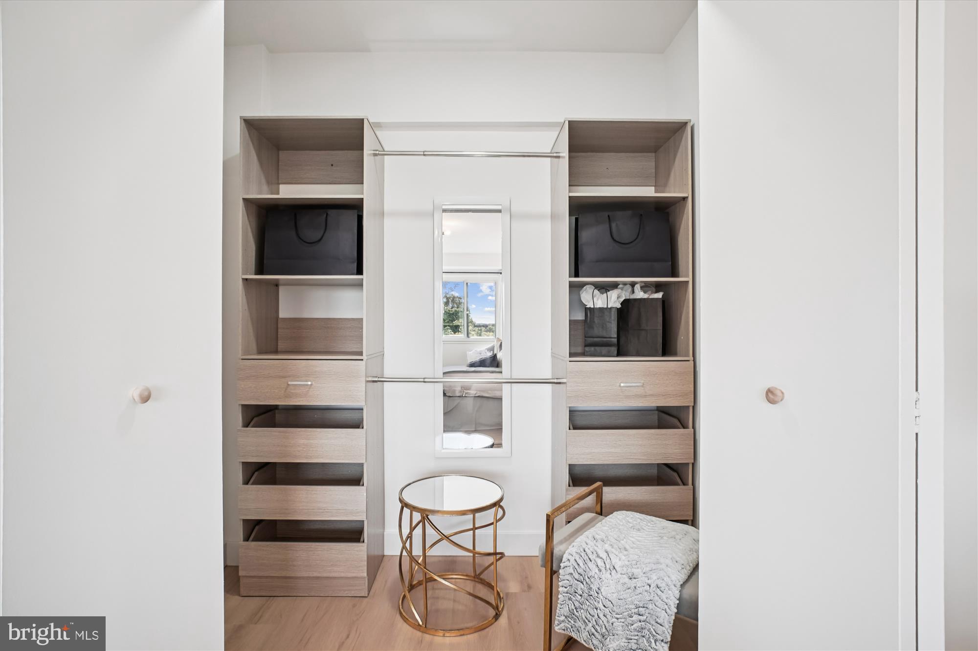4201 Cathedral Avenue Northwest, Unit 1209W Washington, DC 20016 - Photo 16 of 46 a kitchen with a refrigerator and white cabinets