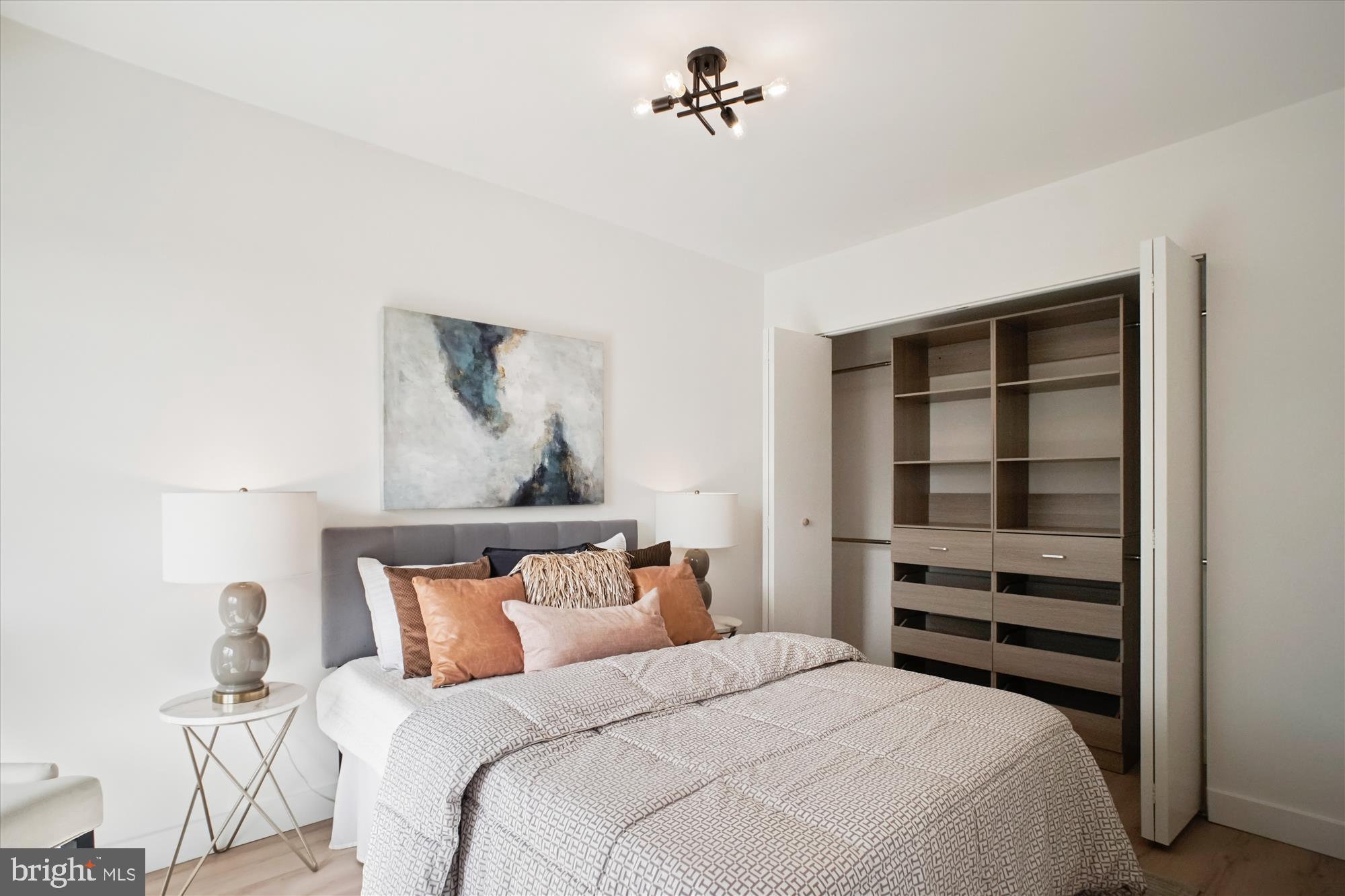 4201 Cathedral Avenue Northwest, Unit 1209W Washington, DC 20016 - Photo 20 of 46 a bedroom with a bed and a window