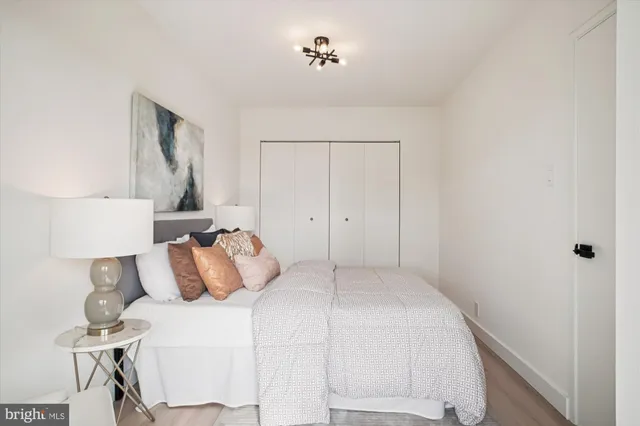 a bedroom with a bed and a table