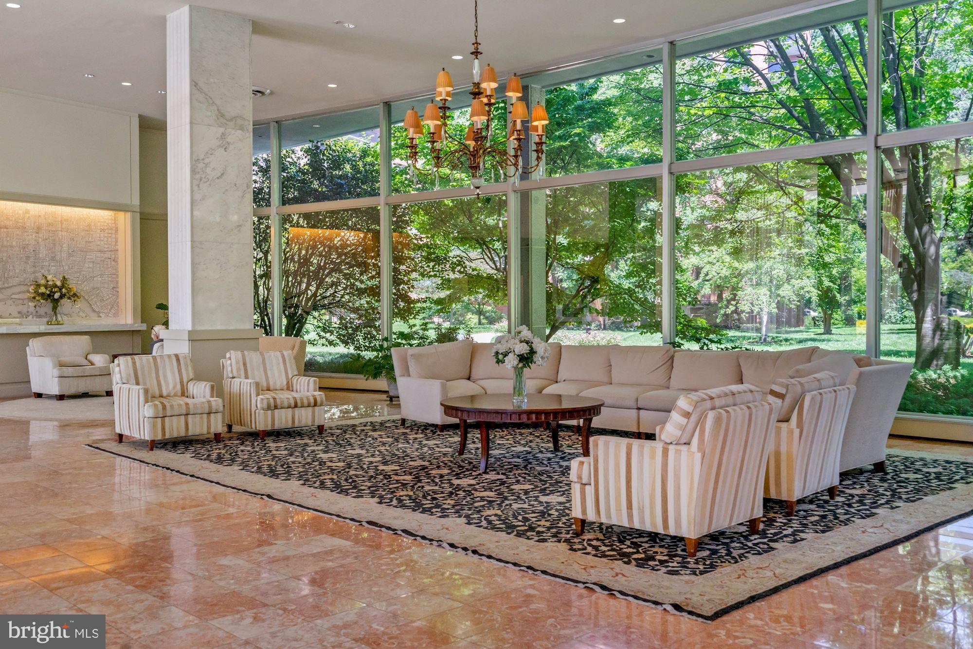 4201 Cathedral Avenue Northwest, Unit 1209W Washington, DC 20016 - Photo 29 of 46 a living room with furniture and a large window