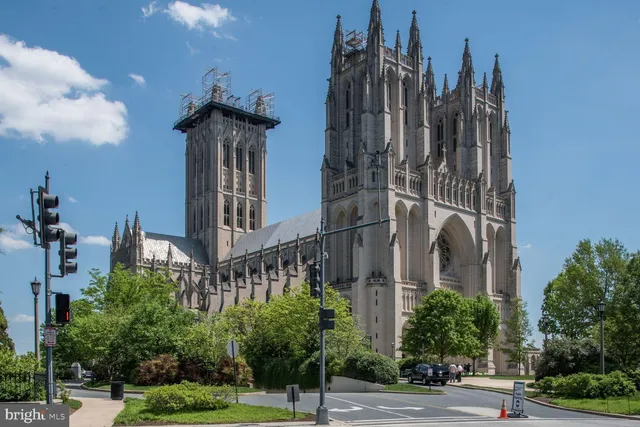 a view of a building with a street