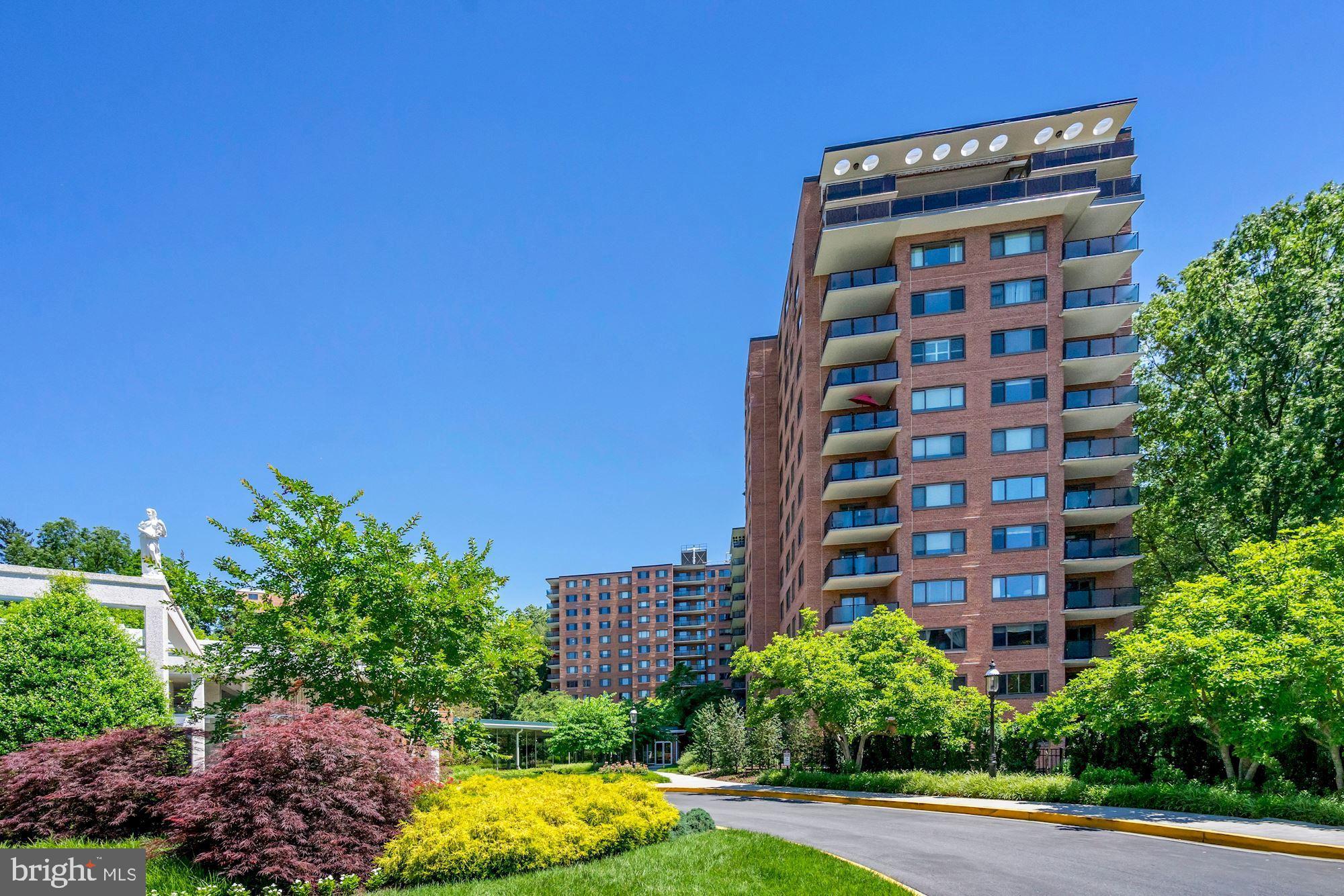 4201 Cathedral Avenue Northwest, Unit 1209W Washington, DC 20016 - Photo 4 of 46 a view of a tall building in the middle of a yard