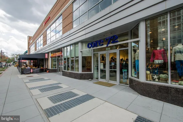 a view of a building with sitting area