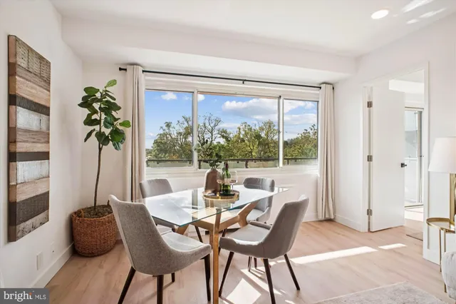 a dining room with furniture window and outside view