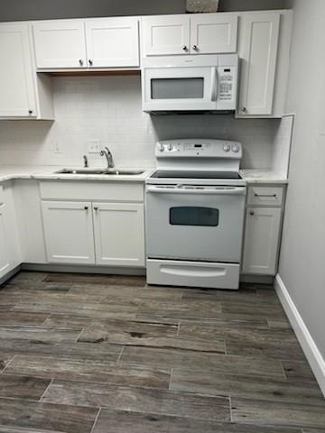 Undisclosed Address Sebastian, FL 32958 - Photo 6 of 14 a kitchen with granite countertop white cabinets and white appliances