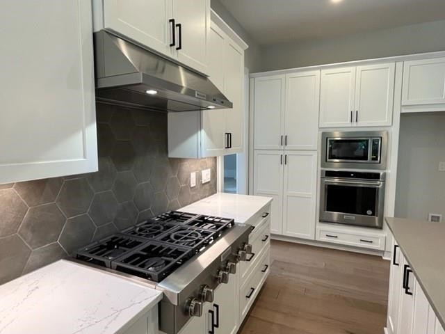2626 Salient Apex, NC 27523 - Photo 13 of 52 a stove top oven sitting inside of a kitchen