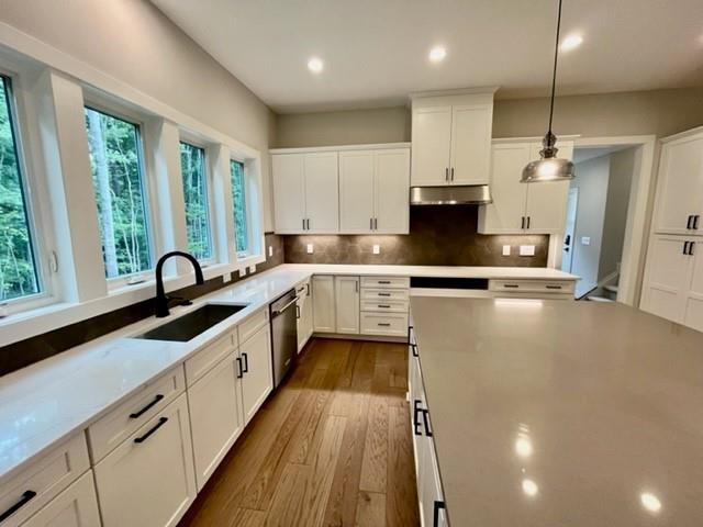 2626 Salient Apex, NC 27523 - Photo 15 of 52 a large kitchen with stainless steel appliances kitchen island granite countertop a sink counter space cabinets and a large window