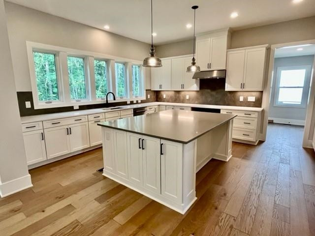 2626 Salient Apex, NC 27523 - Photo 17 of 52 a kitchen with stainless steel appliances granite countertop a sink a stove and a wooden floors