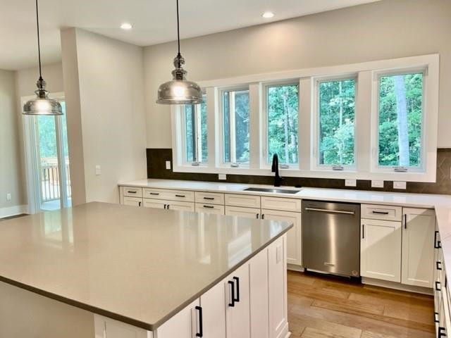 2626 Salient Apex, NC 27523 - Photo 18 of 52 a kitchen with stainless steel appliances granite countertop a stove a sink and a refrigerator