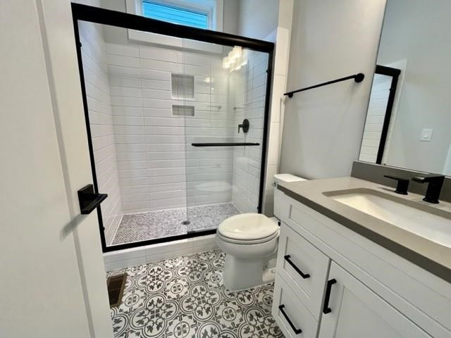 2626 Salient Apex, NC 27523 - Photo 23 of 52 a bathroom with a granite countertop sink toilet and shower