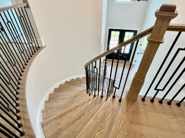 2626 Salient Apex, NC 27523 - Photo 25 of 52 a view of staircase with wooden floor and a rug