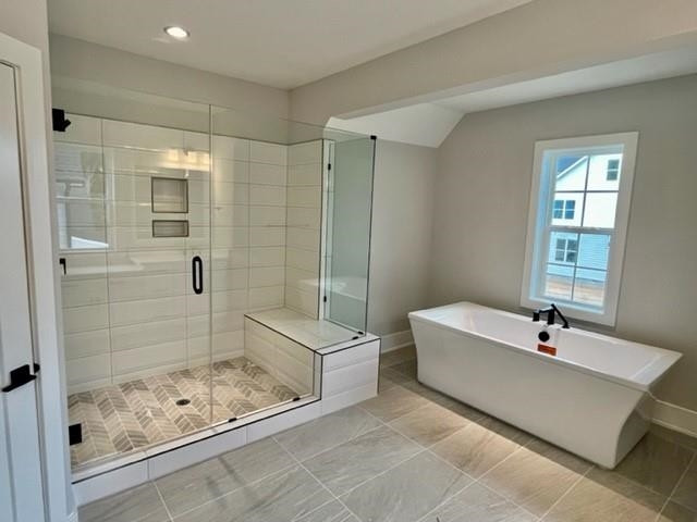 2626 Salient Apex, NC 27523 - Photo 30 of 52 a bathroom with a bathtub shower and toilet