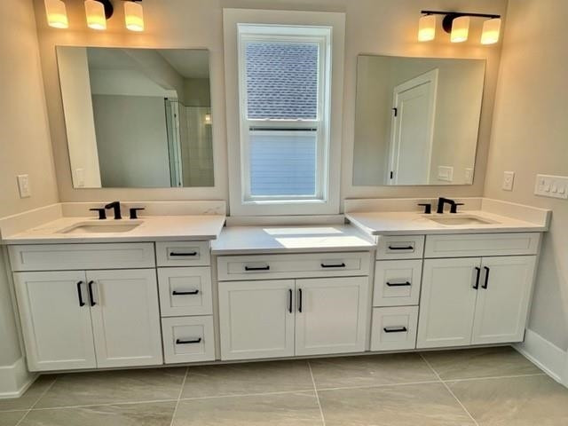 2626 Salient Apex, NC 27523 - Photo 32 of 52 a bathroom with a sink vanity and mirror
