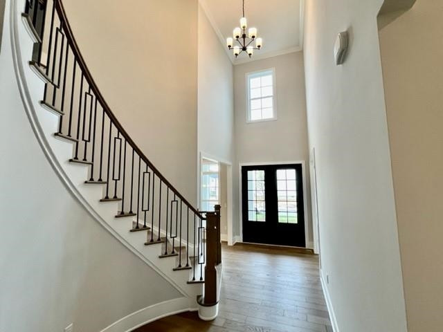 2626 Salient Apex, NC 27523 - Photo 6 of 52 a view of a hallway with wooden floor and staircase