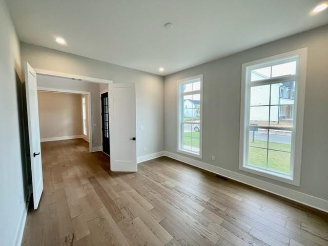 2626 Salient Apex, NC 27523 - Photo 7 of 52 an empty room with wooden floor and windows