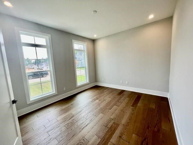 2626 Salient Apex, NC 27523 - Photo 8 of 52 an empty room with wooden floor and windows