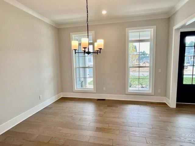 2626 Salient Apex, NC 27523 - Photo 9 of 52 an empty room with wooden floor and windows