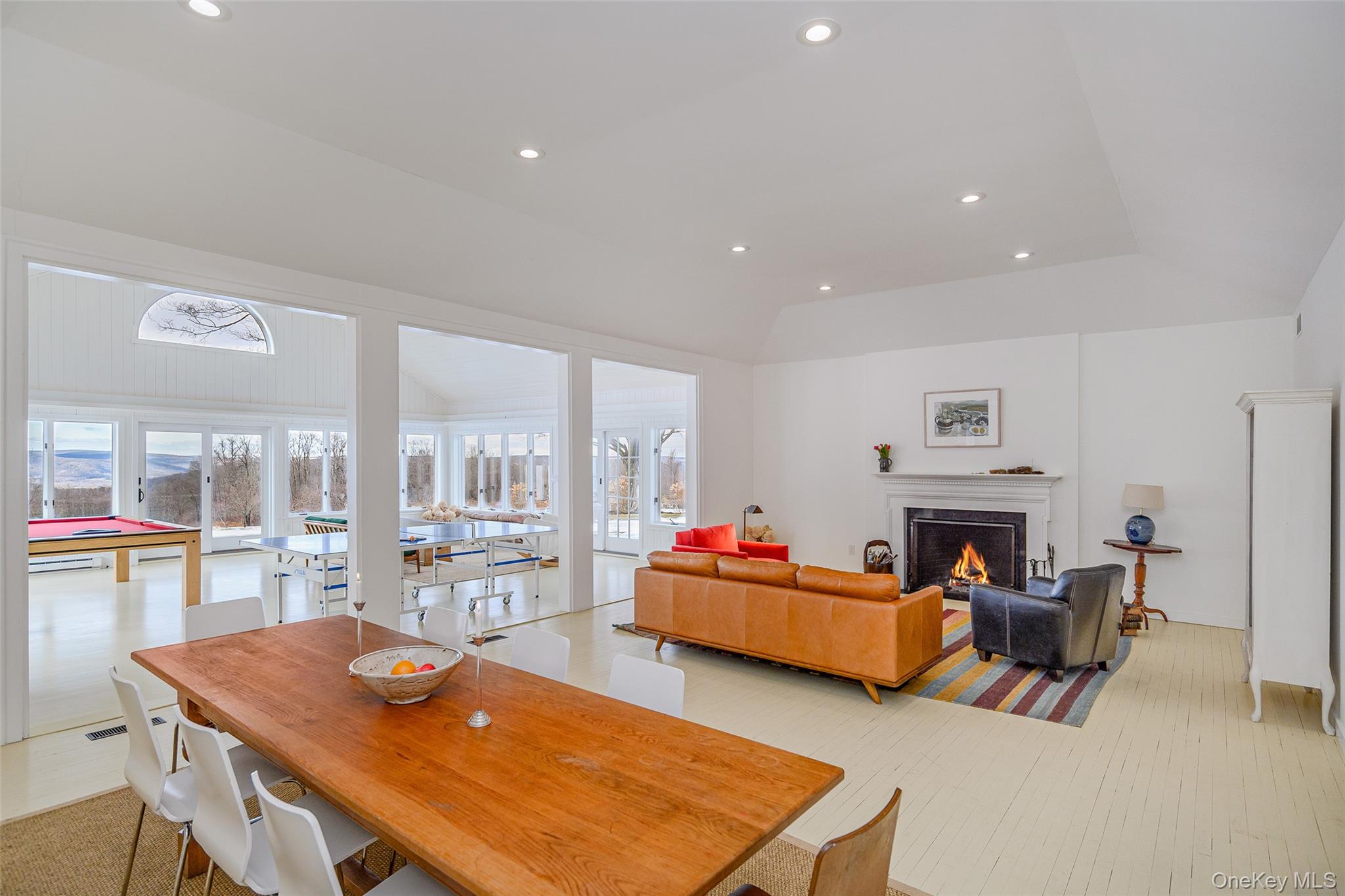 159 Old Quaker Hill Road Pawling, NY 12564 - Photo 11 of 40 Dining space with plenty of natural light, recessed lighting, a lit fireplace, vaulted ceiling, and billiards table