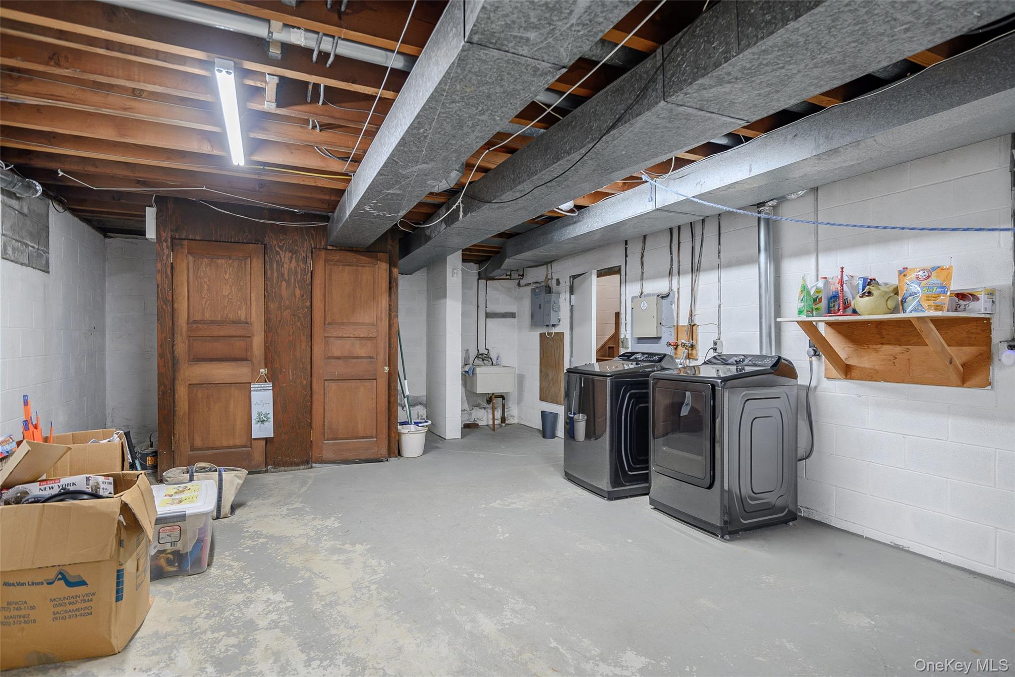 159 Old Quaker Hill Road Pawling, NY 12564 - Photo 31 of 40 Unfinished basement with washer and clothes dryer and electric panel