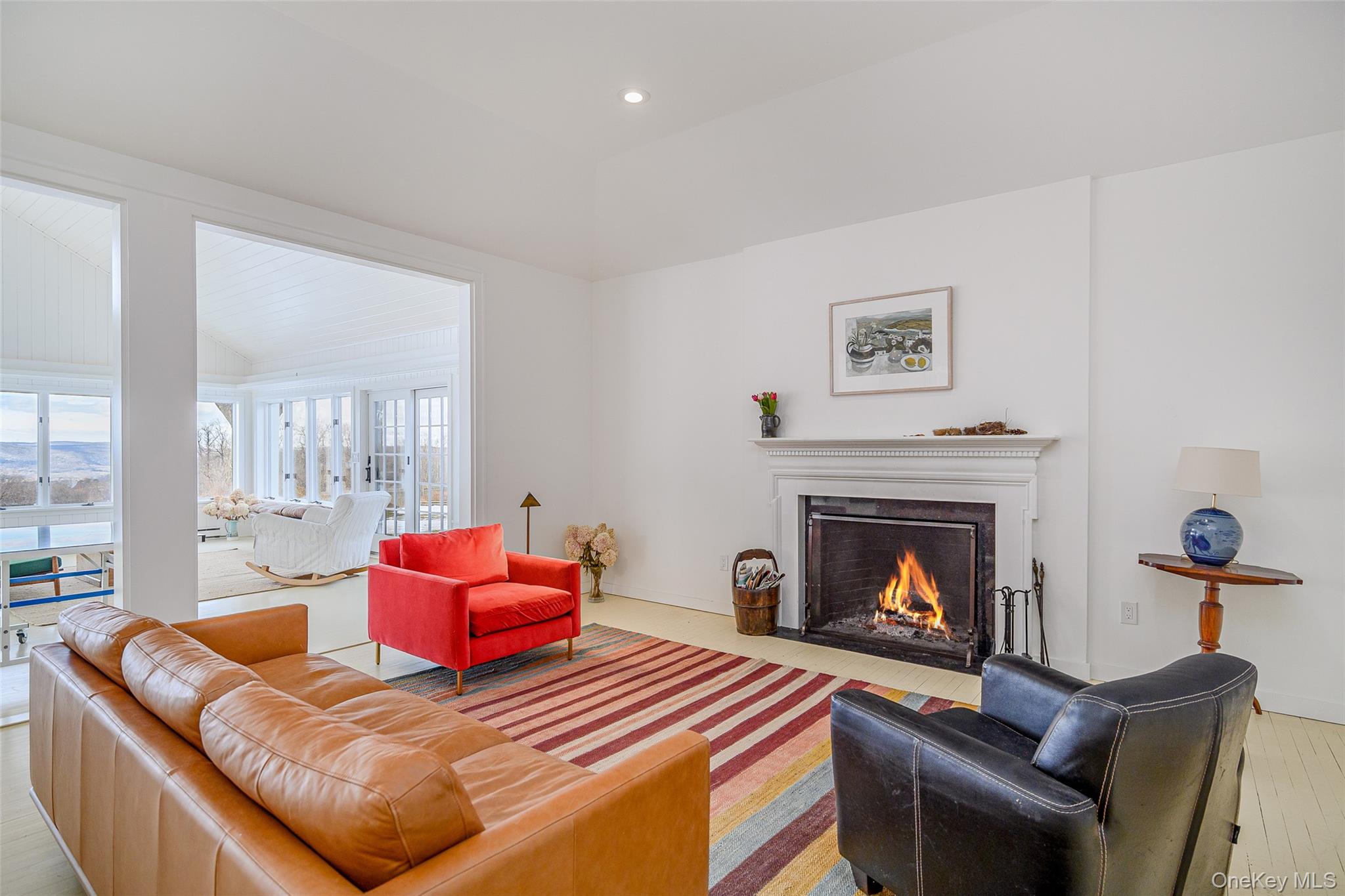159 Old Quaker Hill Road Pawling, NY 12564 - Photo 7 of 40 Living room featuring a fireplace with flush hearth, hardwood / wood-style floors, lofted ceiling, and recessed lighting