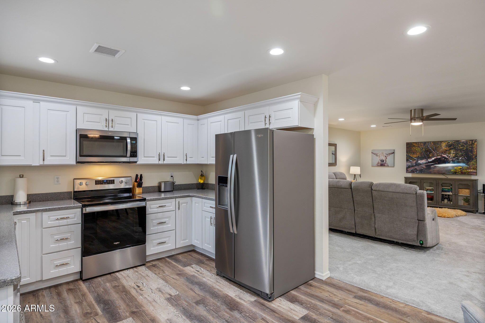 5145 Drifting Snow Loop Pinetop, AZ 85935 - Photo 10 of 37 a kitchen with stainless steel appliances granite countertop a refrigerator stove and sink