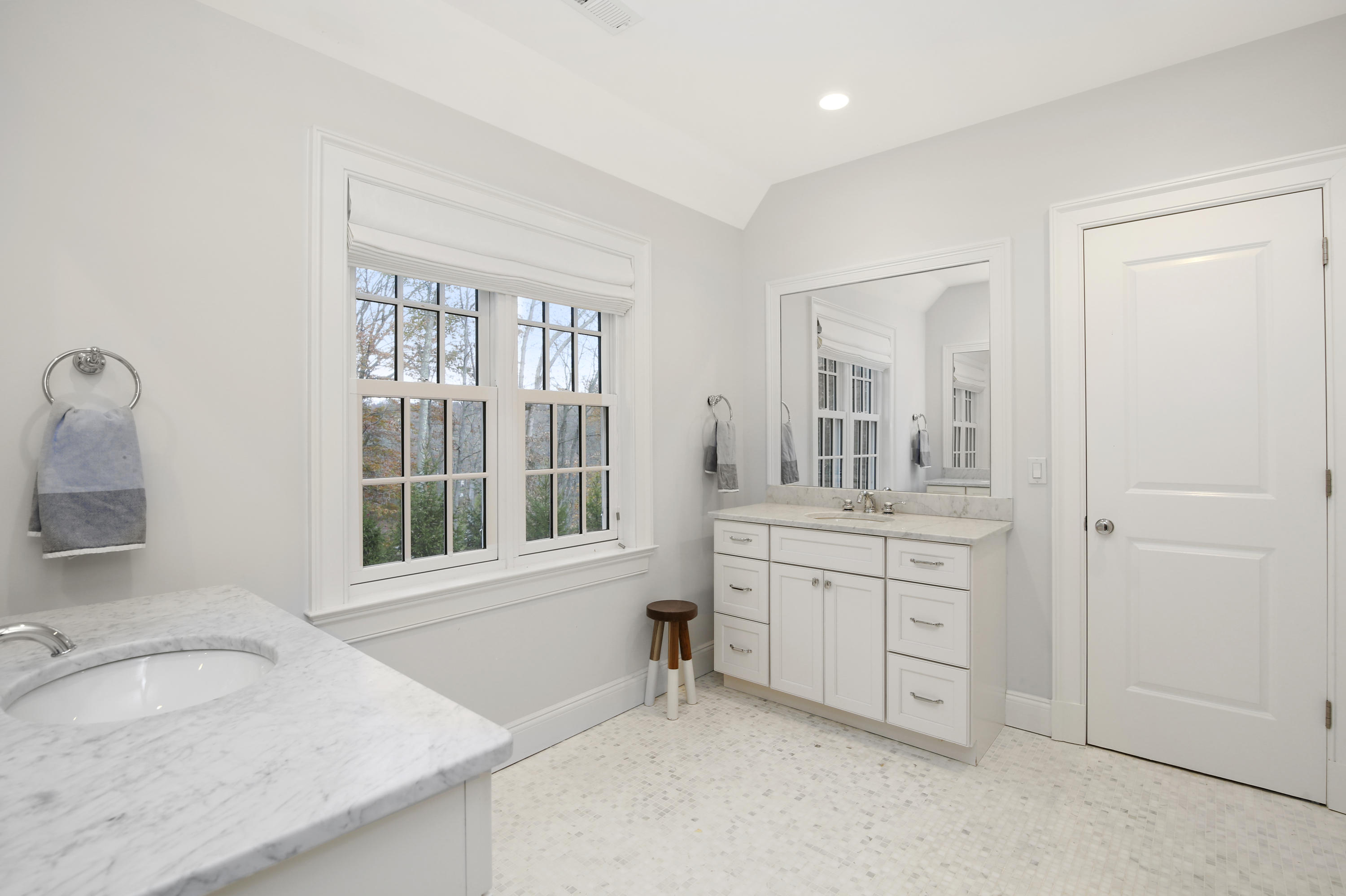 121 Chichester Road New Canaan, CT 06840 - Photo 27 of 42 a bathroom with a granite countertop sink and a window