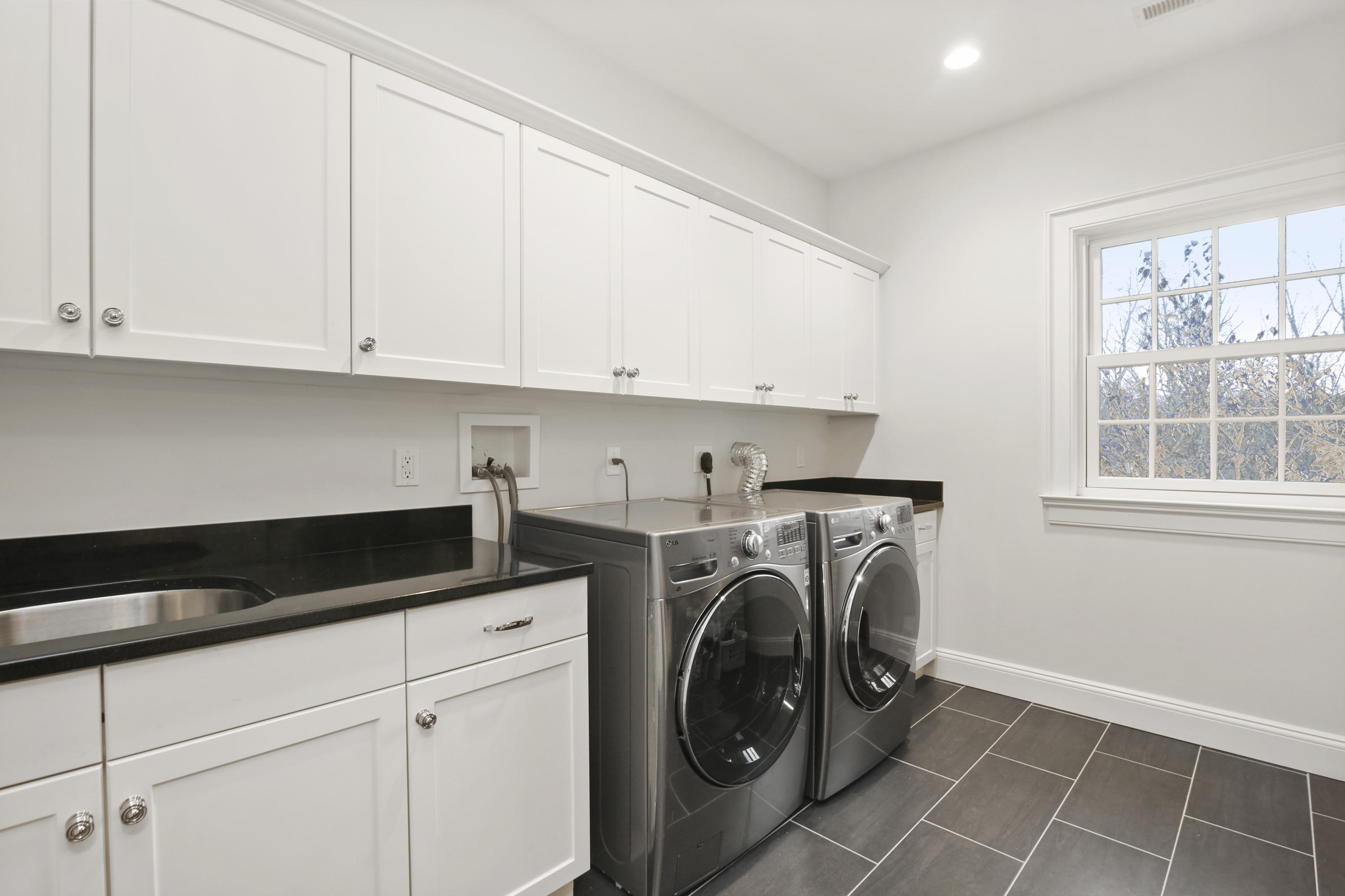 121 Chichester Road New Canaan, CT 06840 - Photo 30 of 42 a utility room with dryer and washer