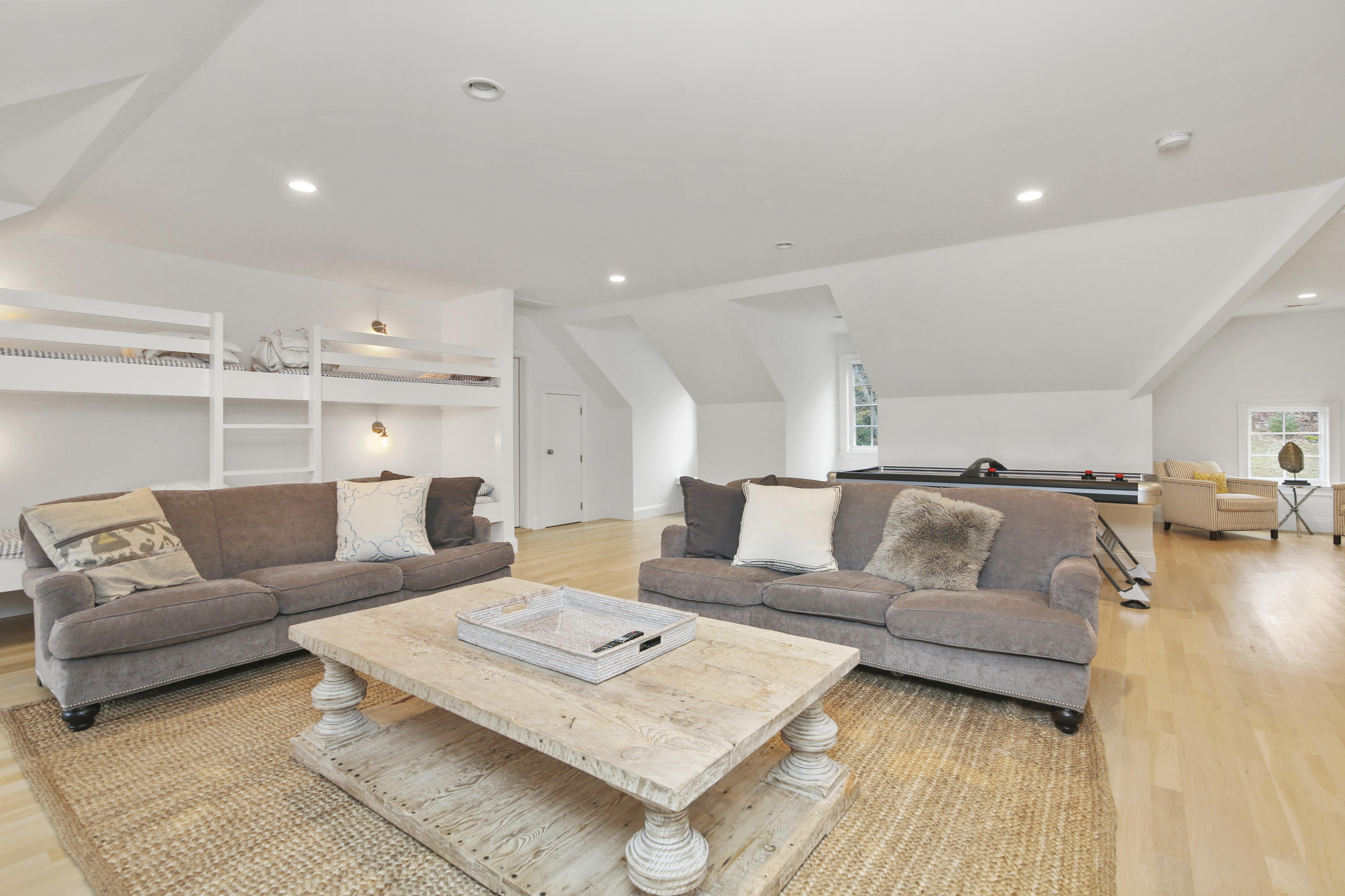 121 Chichester Road New Canaan, CT 06840 - Photo 32 of 42 a living room with furniture and a wooden floor